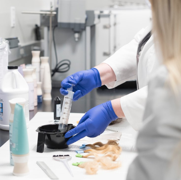 A scientist extracting Alpha Keratin 60ku in a lab that produces Virtue haircare offerings.
