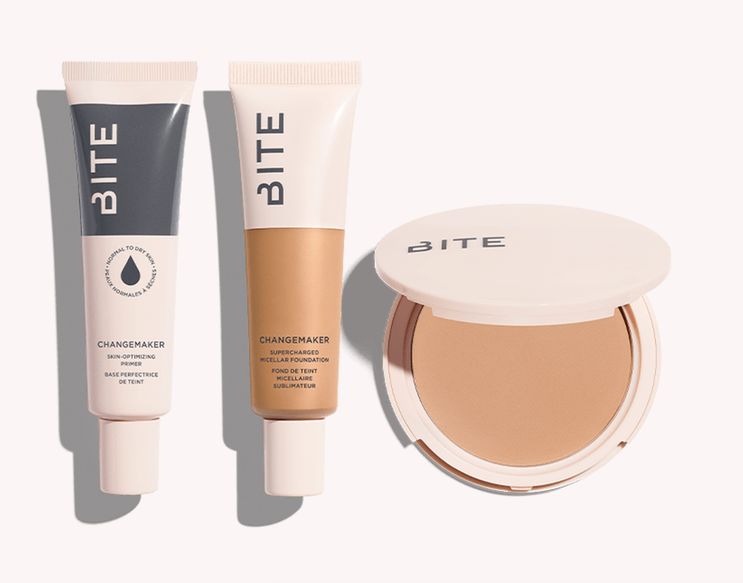 A flat-lay featuring Bite Beauty’s new Changemaker Complexion System of foundation and primer products. 