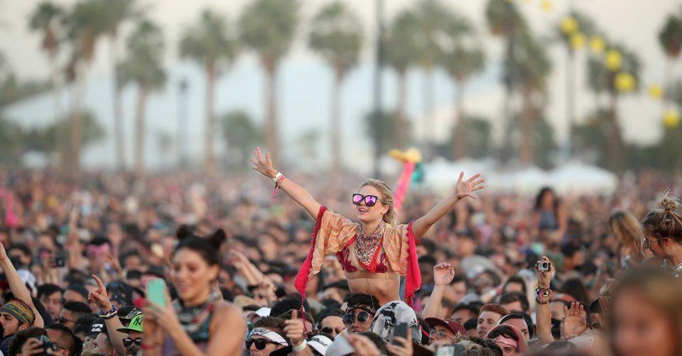 A crowd of young people partying at the Coachella Music Festival. 