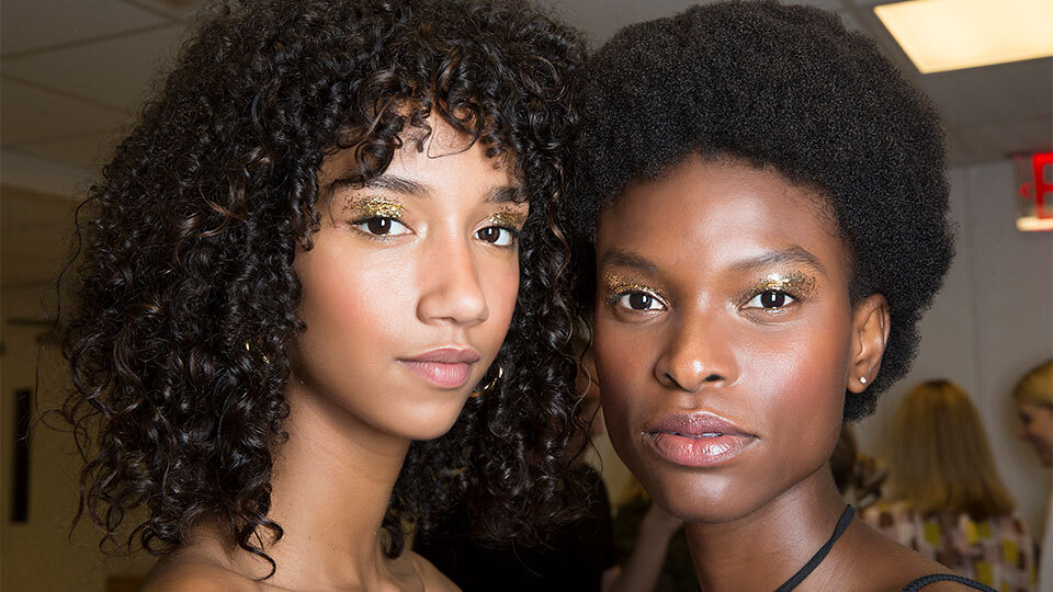 Two models wear makeup from Juvia’s Place. 