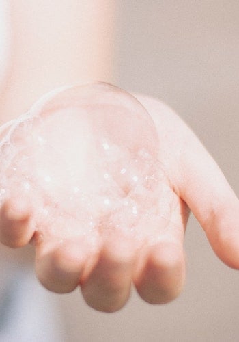 A hand filled with bubbles, by Matthew Tkocz. 