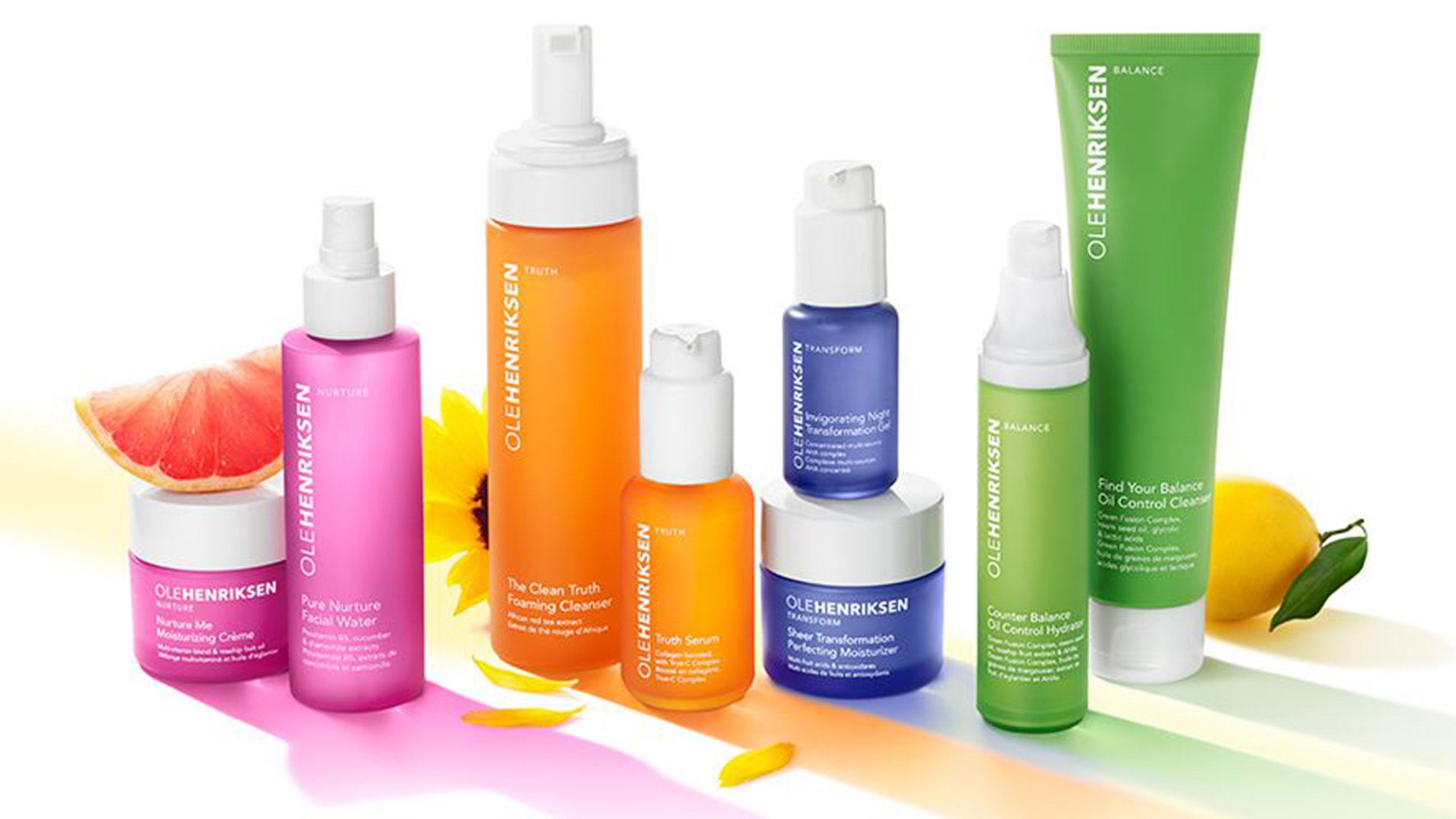 A colorful array of Ole Henriksen products with fruit. 