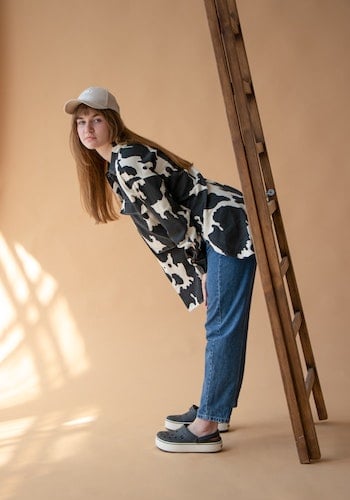 A Gen Z influencer wearing Crocs sandals, by Olha Ivanova.