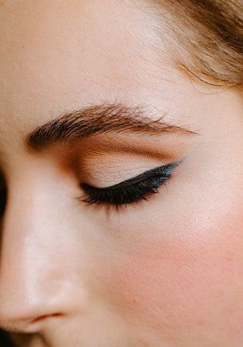 A close-up of winged eyeliner on a Gen Z influencer, by Taylor Heery.