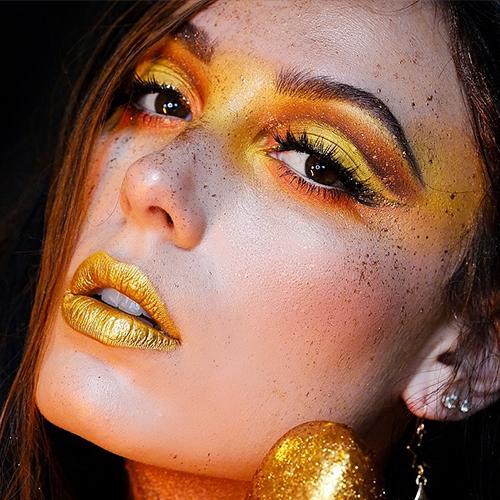 TikTok influencer Victoria Lyn shows off a gold makeup look. 