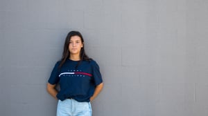 A woman poses in a Tommy Hilfiger top