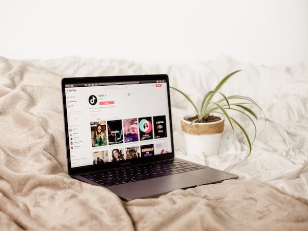 a laptop displaying the TikTok app, by Collabstr via Unsplash