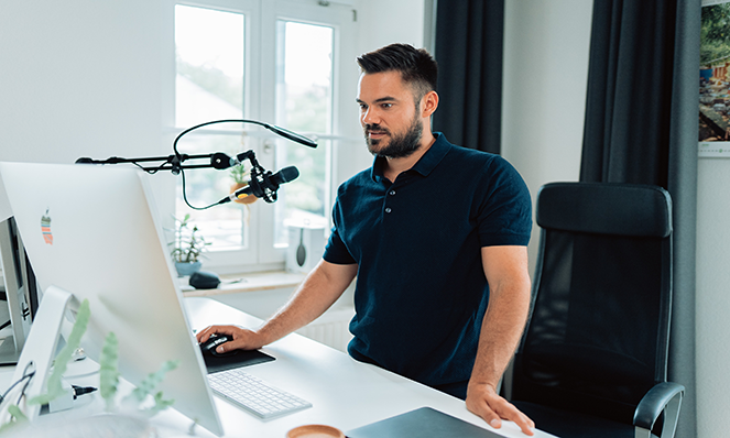 A creator records content on a mic