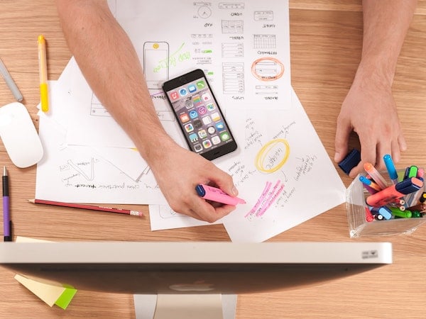 The desk of an influencer marketing manager, by Firmbee via Unsplash.