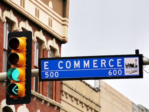 A street sign for "E Commerce," by Mark König via Unsplash.
