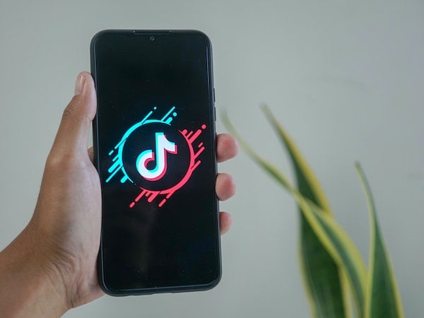 A smartphone with the TikTok app open, by Mourizal Zativa.