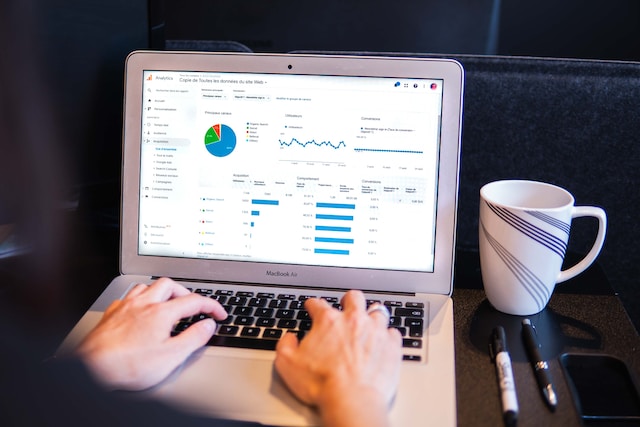 someone reviews data on a laptop