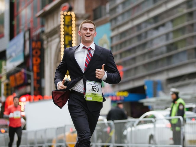 Rex Woodbury breaks a Guinness world record by running a New York City half-marathon in a suit