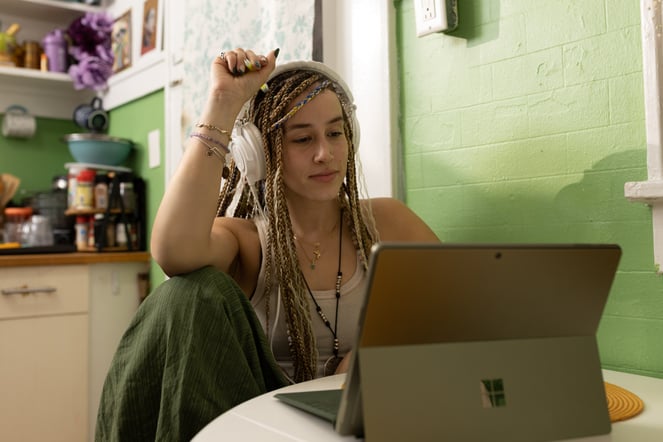 An influencer works on her laptop.