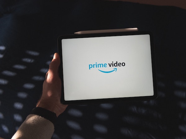 An iPad displaying Amazon Prime Video, which boasts strong influencer marketing partnerships, by Thibault Penin via Unsplash.