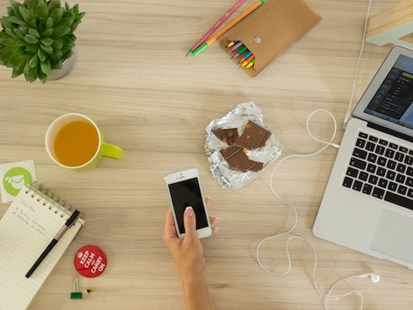 An influencer marketer's desk, by Chris Adamus via Unsplash.