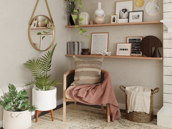 A trendy home interior featuring a boho-style chair, plants, and wall hangings, by Spacejoy via Unsplash.